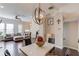 Open concept dining area with modern decor, flowing into the living room and kitchen at 4405 Donahue Ave, Sugar Hill, GA 30518