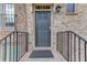 Close-up of the front door featuring stylish hardware and clear address number at 4405 Donahue Ave, Sugar Hill, GA 30518