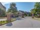 Wrought iron gate flanked by brick pillars provides privacy and security for residents at 4405 Donahue Ave, Sugar Hill, GA 30518