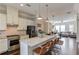 Well-appointed kitchen with a large island, stainless steel appliances, and open layout at 4405 Donahue Ave, Sugar Hill, GA 30518