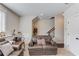 Basement with comfortable leather furniture and staircase at 4405 Donahue Ave, Sugar Hill, GA 30518