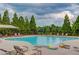 Large community pool offers ample space for swimming and sunbathing, surrounded by lounge chairs at 4405 Donahue Ave, Sugar Hill, GA 30518