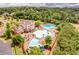 A high angle view of clubhouse, pools, slide and lush greenery showing vibrant community amenities at 233 Retreat Ln, Canton, GA 30114