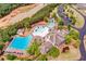 Aerial view of community pools and clubhouse by a pond, showcasing premier amenities at 233 Retreat Ln, Canton, GA 30114