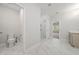 Bright bathroom with white marble floors, a glass shower, and neutral-colored cabinets at 233 Retreat Ln, Canton, GA 30114