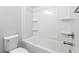 Simple bathroom featuring a tub and shower combination with white plastic shower surround at 233 Retreat Ln, Canton, GA 30114