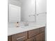 Bathroom vanity with white countertop and modern faucet, complemented by a large mirror at 233 Retreat Ln, Canton, GA 30114