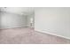 Large empty bedroom featuring soft carpet and neutral walls with an ensuite bathroom at 233 Retreat Ln, Canton, GA 30114