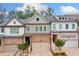 Charming townhome with brick accents, a one-car garage, and well-maintained landscaping at 233 Retreat Ln, Canton, GA 30114
