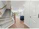 Inviting foyer featuring a staircase and hardwood flooring, offering a glimpse into the spacious living area at 233 Retreat Ln, Canton, GA 30114