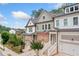 Charming townhomes featuring brick accents and well-maintained landscaping at 233 Retreat Ln, Canton, GA 30114