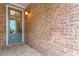 Welcoming front porch with a brick exterior and stylish entry door at 233 Retreat Ln, Canton, GA 30114
