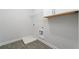 Utility room features grey tile floors and white walls with washer and dryer hookups at 233 Retreat Ln, Canton, GA 30114