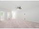 Spacious, carpeted living room with a ceiling fan and access to a private bathroom at 233 Retreat Ln, Canton, GA 30114