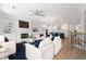 Bright living room with fireplace, built-ins, and open floor plan connecting to a modern kitchen at 233 Retreat Ln, Canton, GA 30114