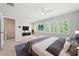 Spacious main bedroom featuring large windows, a ceiling fan, and ample natural light at 233 Retreat Ln, Canton, GA 30114