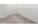 Empty walk-in closet with wire shelves and neutral carpeting ready to be filled at 233 Retreat Ln, Canton, GA 30114