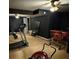 Basement workout area featuring a treadmill and home gym equipment on light wood-look flooring at 405 Fairburn Sw Rd # 64, Atlanta, GA 30331