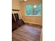 Minimalist bedroom featuring hardwood floors and a window with a view to the backyard at 405 Fairburn Sw Rd # 64, Atlanta, GA 30331