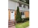Charming townhome featuring a tidy front lawn and well-maintained exterior with neutral siding and maroon shutters at 405 Fairburn Sw Rd # 64, Atlanta, GA 30331