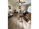 Bright living room with light wood floors, exercise equipment, and a comfortable reclining chair at 405 Fairburn Sw Rd # 64, Atlanta, GA 30331