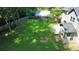 Lush backyard offering ample green space, mature trees, and an enclosed patio at 4635 Tims Pl, Snellville, GA 30039