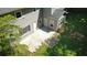 Spacious backyard with concrete patio, stone path, and gray siding on the two-story home at 4635 Tims Pl, Snellville, GA 30039