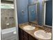 Bathroom featuring dual sinks, granite countertops, updated fixtures, tile accents and neutral decor at 4635 Tims Pl, Snellville, GA 30039