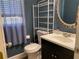 Bathroom boasts a modern vanity, updated fixtures, and storage shelves for organization at 4635 Tims Pl, Snellville, GA 30039