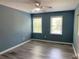 Bright bedroom with large windows, new flooring, and a comfortable atmosphere at 4635 Tims Pl, Snellville, GA 30039