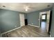 Cozy bedroom with new flooring, ceiling fan, and a neutral color scheme at 4635 Tims Pl, Snellville, GA 30039