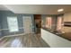 Updated kitchen featuring stainless steel appliances, modern cabinetry, granite counters, and new flooring at 4635 Tims Pl, Snellville, GA 30039
