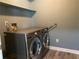 Convenient laundry room with modern front-load washer and dryer set at 4635 Tims Pl, Snellville, GA 30039