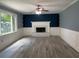 Elegant living room with a fireplace, white mantle, and hardwood floors at 4635 Tims Pl, Snellville, GA 30039