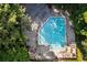 Aerial view of a swimming pool, surrounded by trees at 1001 Braelin Ct, Woodstock, GA 30189