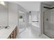 Bright bathroom features a soaking tub and glass-door shower at 1001 Braelin Ct, Woodstock, GA 30189