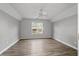 An open and bright bedroom with a large window for natural light at 1001 Braelin Ct, Woodstock, GA 30189