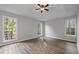 Spacious bedroom with tray ceilings and beautiful hardwood floors at 1001 Braelin Ct, Woodstock, GA 30189