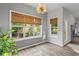 Cozy dining area with large windows offering ample natural light and a view to the backyard at 1001 Braelin Ct, Woodstock, GA 30189