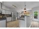 Well-equipped kitchen with stainless steel appliances and natural light at 1001 Braelin Ct, Woodstock, GA 30189