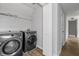 Convenient laundry room with modern appliances and storage space at 1001 Braelin Ct, Woodstock, GA 30189