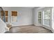Inviting living area with large windows and staircase detail, showing natural light at 1001 Braelin Ct, Woodstock, GA 30189