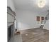 Spacious living room featuring a fireplace, large windows and staircase access at 1001 Braelin Ct, Woodstock, GA 30189