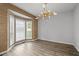 Bright, spacious room featuring a bay window and stylish chandelier at 1001 Braelin Ct, Woodstock, GA 30189