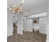 Bright, open living space featuring modern lighting and sliding barn doors at 1001 Braelin Ct, Woodstock, GA 30189