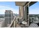 Balcony featuring wood flooring, outdoor seating, and beautiful city views at 270 17Th Nw St # 2804, Atlanta, GA 30363