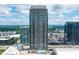 Striking high-rise building featuring a rooftop pool and stunning views of the surrounding cityscape and lush greenery at 270 17Th Nw St # 2804, Atlanta, GA 30363