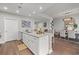 Bright kitchen and dining area featuring stone countertops and a view into the adjoining living room at 270 17Th Nw St # 2804, Atlanta, GA 30363