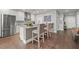 Modern kitchen featuring white cabinets, stainless appliances, and a kitchen island with bar stool seating at 270 17Th Nw St # 2804, Atlanta, GA 30363