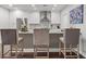 Modern kitchen with white cabinets, stainless steel appliances, and a breakfast bar with seating at 270 17Th Nw St # 2804, Atlanta, GA 30363
